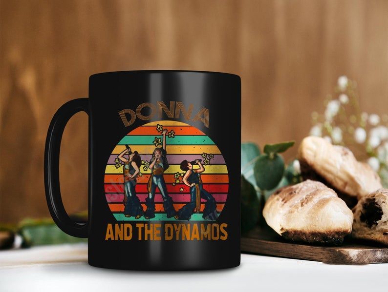 Retro Vintage Donna And The Dynamos Mug Donna Sheridan Tanya Chesham Leigh Rosie Mulligan Premium Sublime Ceramic Coffee Mug Black