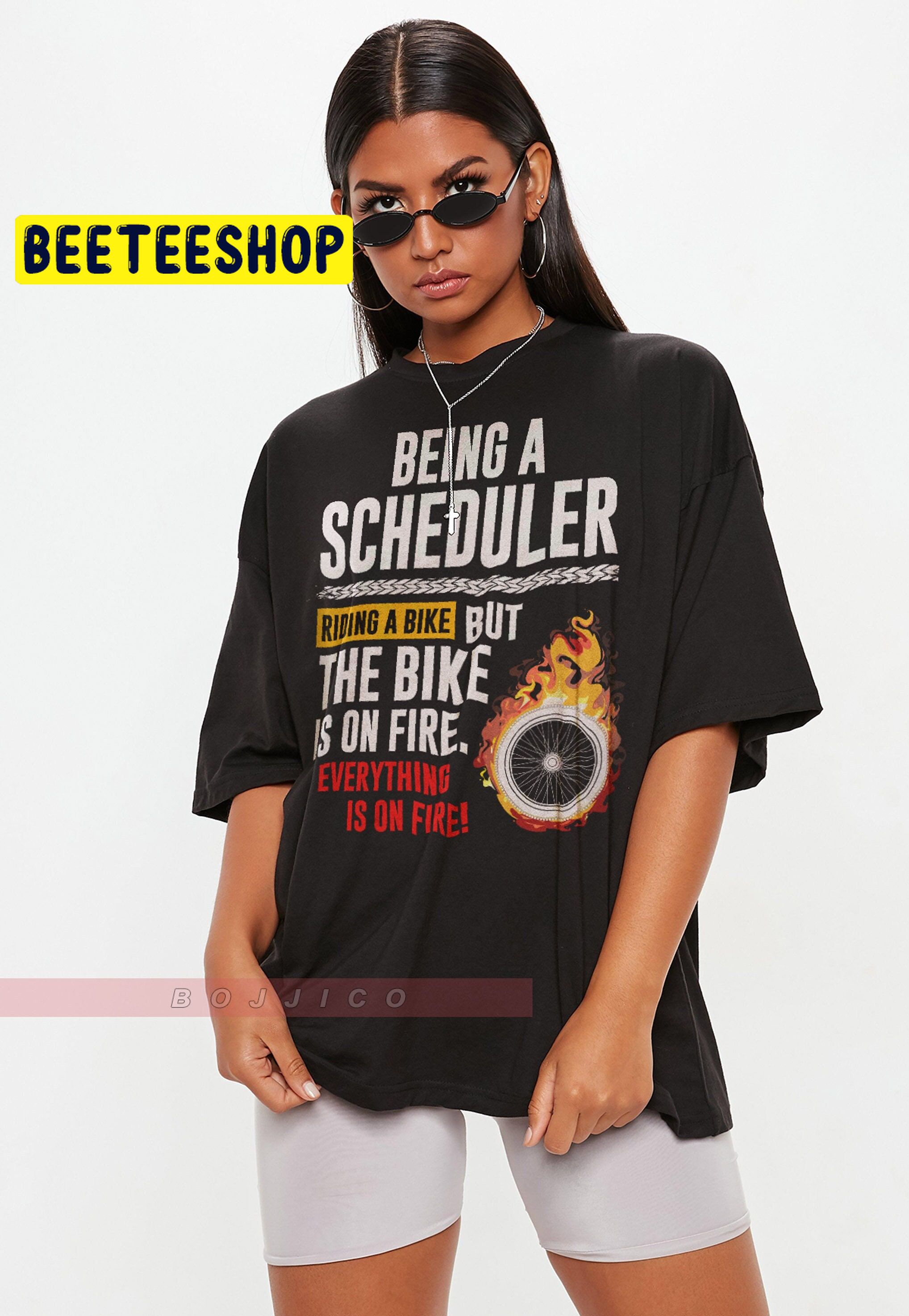 Being A Scheduler Is Like Riding Bike On Fire Trending Unisex T-Shirt